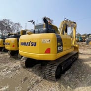 2022 Komatsu PC120-8 crawler excavator, rear three-quarter view 2022 Komatsu PC120-8 crawler excavator, rear three-quarter view