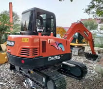 2022 Doosan DH55 mini excavator rear three-quarter view 2022 Doosan DH55 mini excavator rear three-quarter view