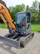 2022 CASE CX60C mini excavator, side view