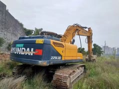 2023 Hyundai R225LVS excavator, rear three-quarter view