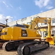 2014 Komatsu PC300 crawler excavator, rear three-quarter view