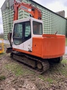 2004 Daewoo 75 mini excavator, rear three-quarter view 2004 Daewoo 75 mini excavator, rear three-quarter view