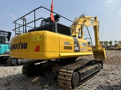 Komatsu PC450-7 crawler excavator, rear three-quarter view