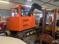1986 Hitachi UH033 crawler excavator, rear three-quarter view 1986 Hitachi UH033 crawler excavator, rear three-quarter view