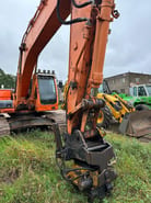 2009 Doosan DX255LC crawler excavator, front view of boom and attachment