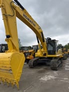 2025 Komatsu PC300 crawler excavator, front three-quarter view