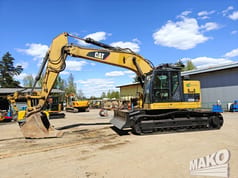 2012 Caterpillar 328D LCR crawler excavator, side profile view