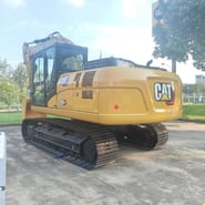 2025 Caterpillar 320GX crawler excavator, rear three-quarter view