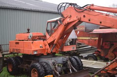1973 Atlas 1602 wheel excavator, rear three-quarter view