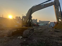 Caterpillar 315D2 GC crawler excavator, rear three-quarter view Caterpillar 315D2 GC crawler excavator, rear three-quarter view