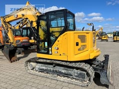 2024 Caterpillar 308 mini excavator, rear three-quarter view