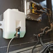 2023 Volvo EC210 crawler excavator fluid reservoir and electrical component detail
