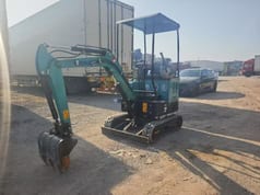 2023 Komatsu PC18 mini excavator, front three-quarter view