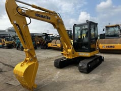 2022 Komatsu PC56-7 mini excavator, front three-quarter view