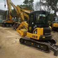 Komatsu PC-55MR mini excavator, three-quarter view