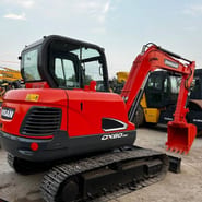2024 Doosan DX60-9C mini excavator, rear three-quarter view