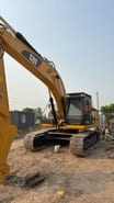2023 Caterpillar 325 crawler excavator, side view