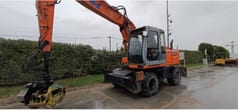 2002 New Holland EX165W wheel excavator, side view
