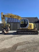 2006 New Holland E135SR-1E crawler excavator, side view 2006 New Holland E135SR-1E crawler excavator, side view
