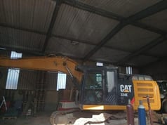 2011 Caterpillar 324E crawler excavator, side view