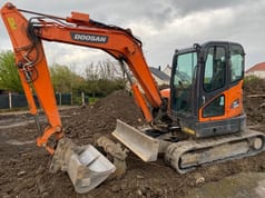 2018 Doosan DX62R-3 mini excavator, side view 2018 Doosan DX62R-3 mini excavator, side view