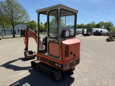 1990 Schaeff HR02 mini excavator, rear three-quarter view