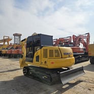 Komatsu PC70-8 mini excavator, rear three-quarter view Komatsu PC70-8 mini excavator, rear three-quarter view