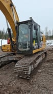 2017 Caterpillar 323F crawler excavator, side view of cab and tracks