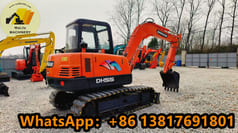 2021 Doosan DH55 mini excavator, rear three-quarter view 2021 Doosan DH55 mini excavator, rear three-quarter view