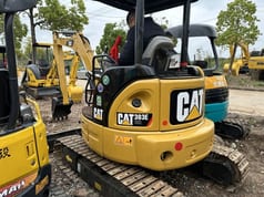 Caterpillar 303E CR mini excavator rear view Caterpillar 303E CR mini excavator rear view