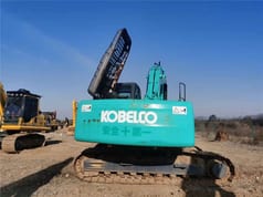 Kobelco SK210 crawler excavator rear view