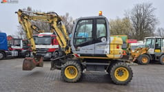 2009 New Holland MH 2.6 wheel excavator, side view 2009 New Holland MH 2.6 wheel excavator, side view