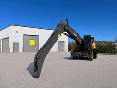 2021 Volvo EW240EMH material handler, rear three-quarter view