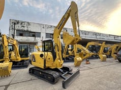 2022 Komatsu PC56-7 mini excavator, front three-quarter view 2022 Komatsu PC56-7 mini excavator, front three-quarter view