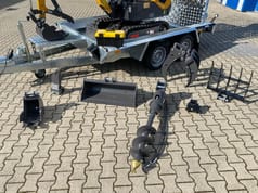 Berger Kraus BK1000JSR mini excavator with attachments on trailer