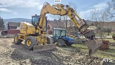 2013 Komatsu PW118 MR-8 wheel excavator, side profile view