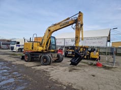 1998 Komatsu PW130ES-6K wheel excavator, side view
