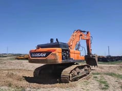 Doosan DX520LC-9C crawler excavator, rear three-quarter view
