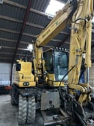 2018 Komatsu PW148-11 wheel excavator, front three-quarter view 2018 Komatsu PW148-11 wheel excavator, front three-quarter view