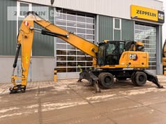 2020 Caterpillar MH3024-06C material handler side view 2020 Caterpillar MH3024-06C material handler side view