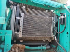 Kobelco SK210 crawler excavator engine compartment radiator view Kobelco SK210 crawler excavator engine compartment radiator view