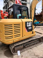 2022 Caterpillar 306E excavator, rear three-quarter view 2022 Caterpillar 306E excavator, rear three-quarter view