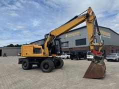 2019 Caterpillar M318F wheel excavator, side view
