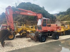 1992 Atlas 1704 wheel excavator, side profile view
