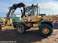2002 Mecalac 12MXT wheel excavator, side view