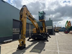 2018 Caterpillar MH3024 material handler, front three-quarter view