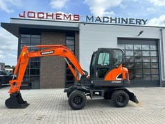 2018 Doosan DX60 wheel excavator, side profile view 2018 Doosan DX60 wheel excavator, side profile view