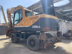 2024 Hyundai R210W-9 wheel excavator, rear three-quarter view
