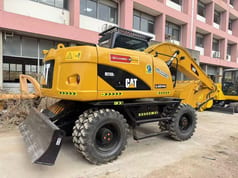 2023 Caterpillar M315D2 wheel excavator, rear three-quarter view
