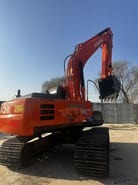 2023 Hitachi Zaxis 210 crawler excavator, rear three-quarter view